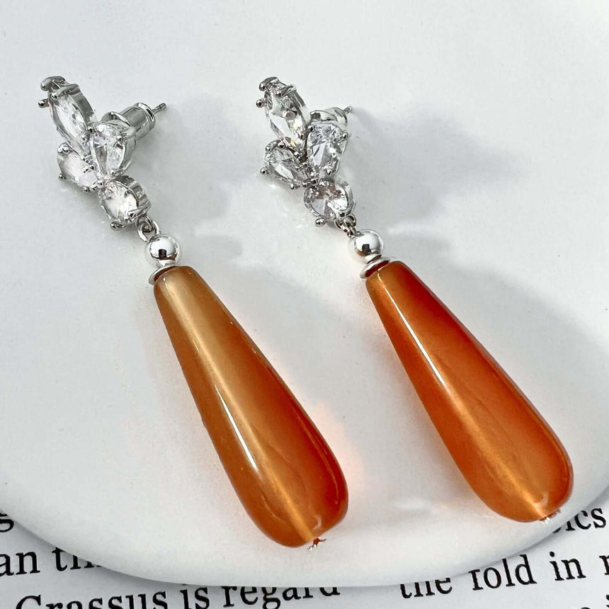 Loux oorbellen met oranje natuursteen