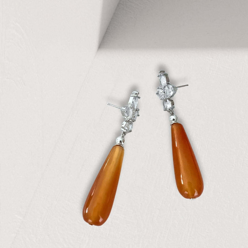 Loux oorbellen met oranje natuursteen