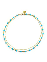 Asya turquoise dubbele ketting met Azra turquoise kralen en bedels, stijlvolle en unieke sieradenaccessoire.