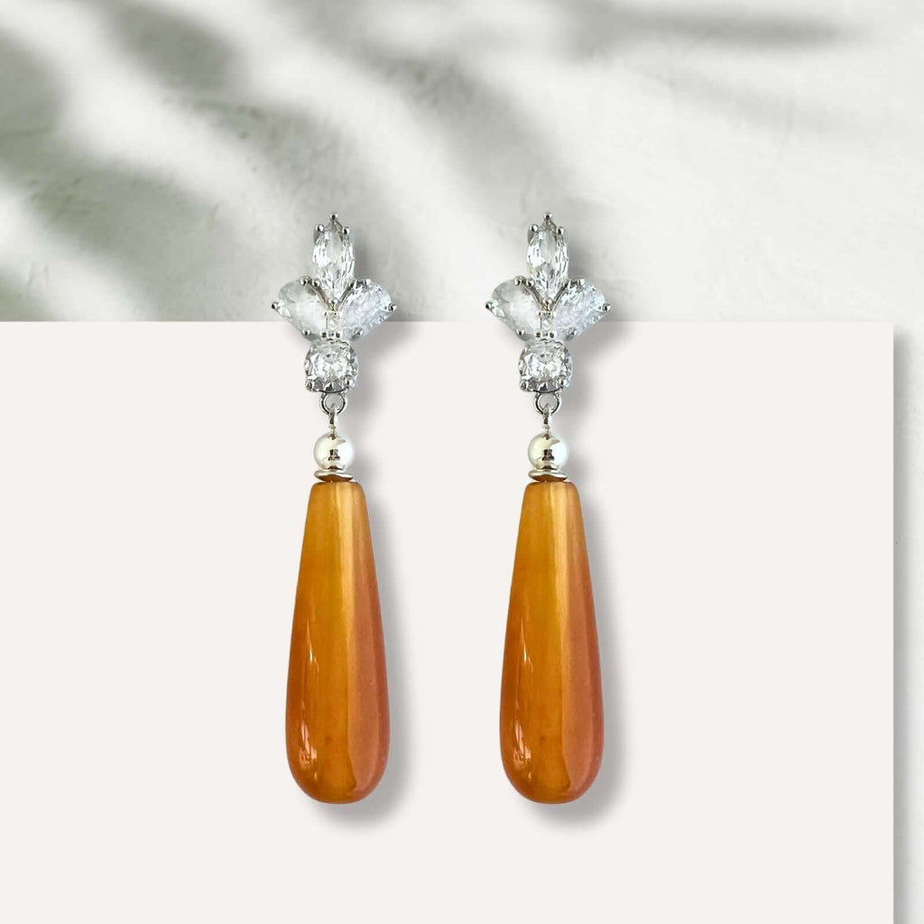 Loux oorbellen met oranje natuursteen