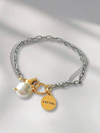 Luus dubbele schakelarmband met parel hanger