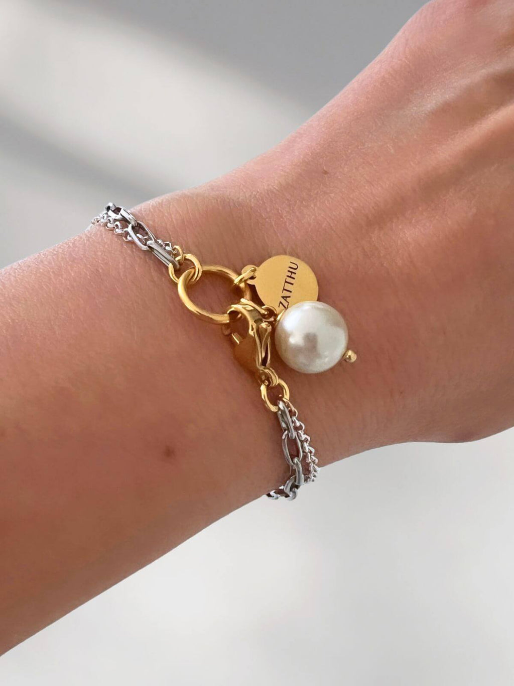 Luus dubbele schakelarmband met parel hanger