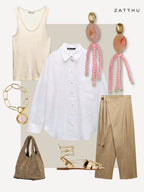 Fashion outfit with white shirt, beige tank top, brown pants, gold sandals, bag, pink agate earrings, and gold bracelet.
