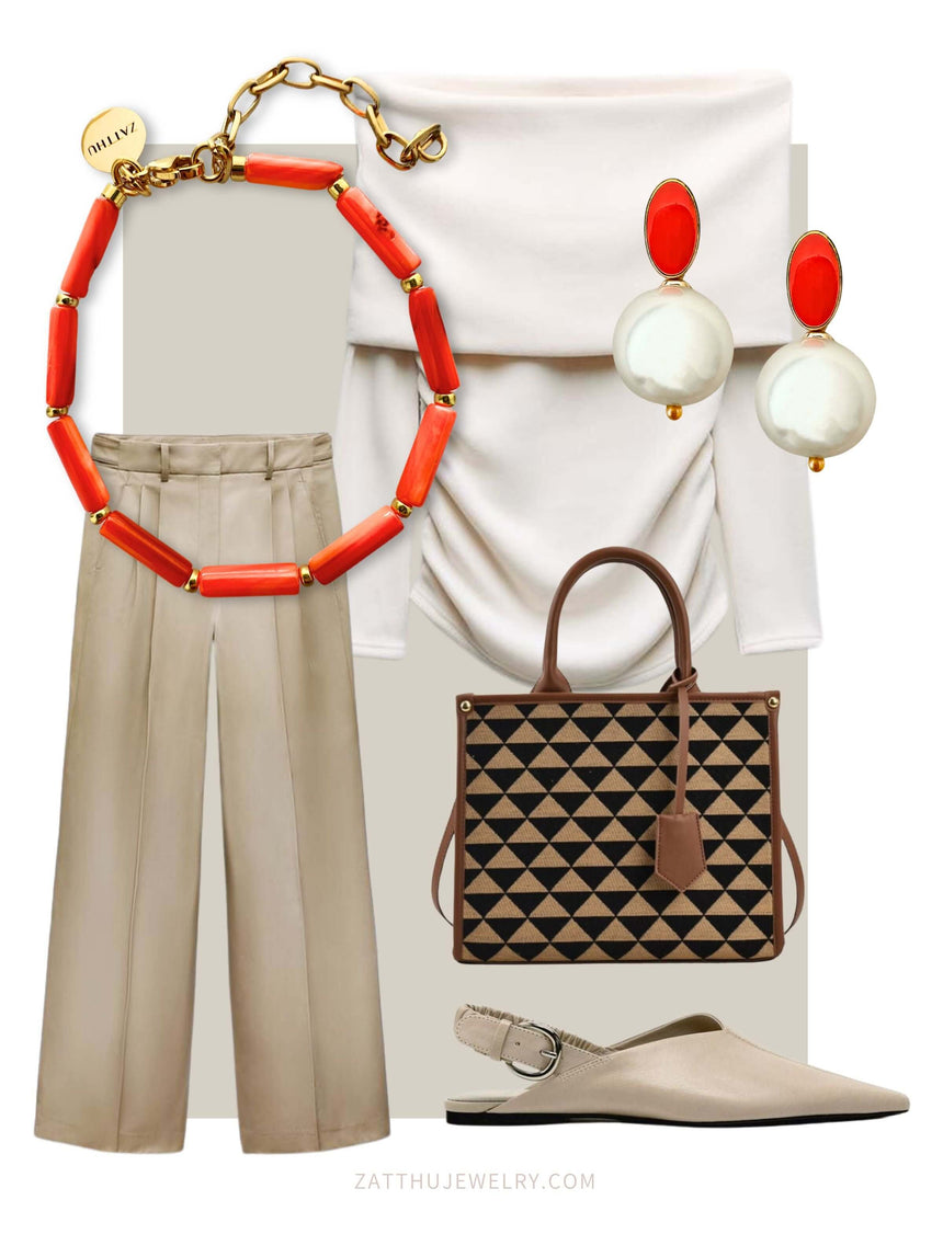 Elegant beige trousers and top with orange bead necklace, pearl earrings, geometric-patterned handbag, and beige flats.