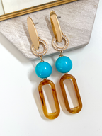 Isae bruine statement oorbellen met turquoise
