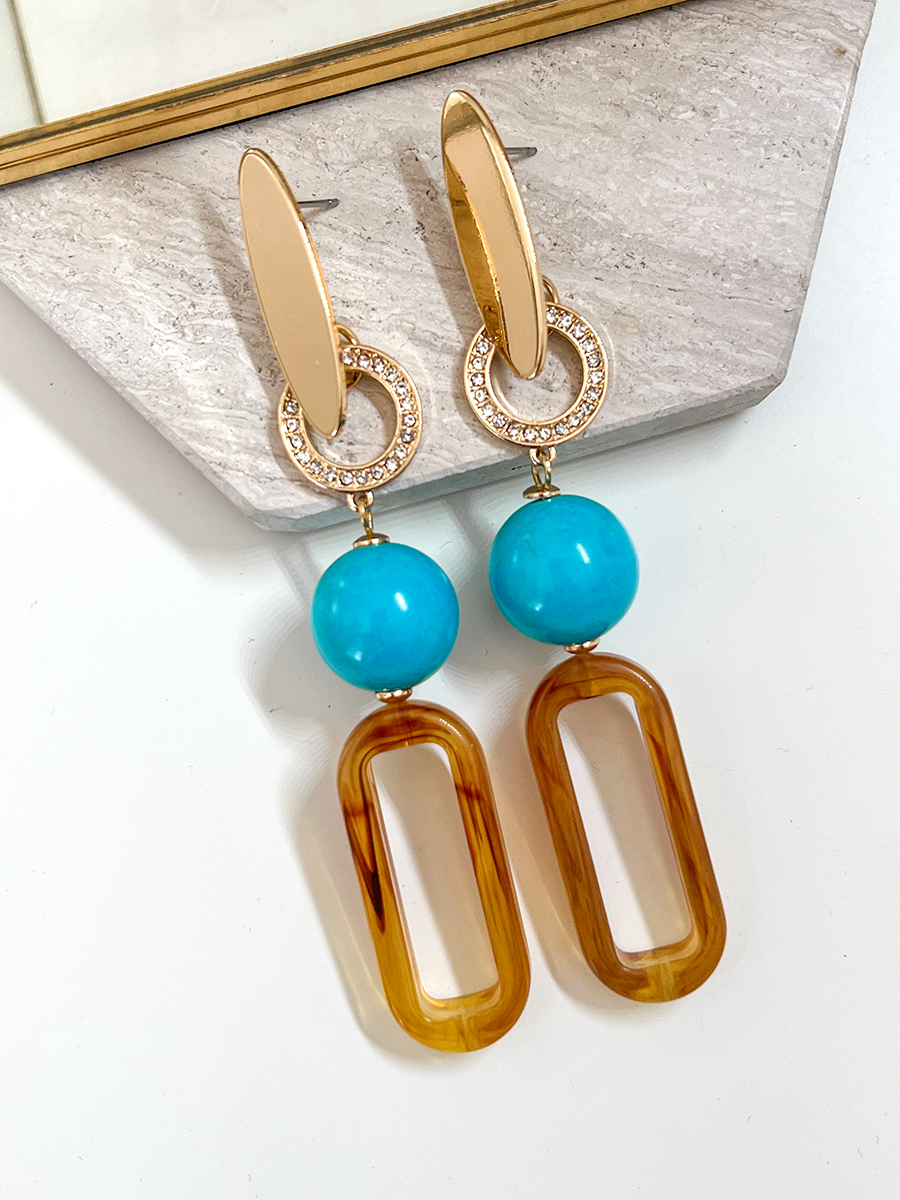 Isae bruine statement oorbellen met turquoise