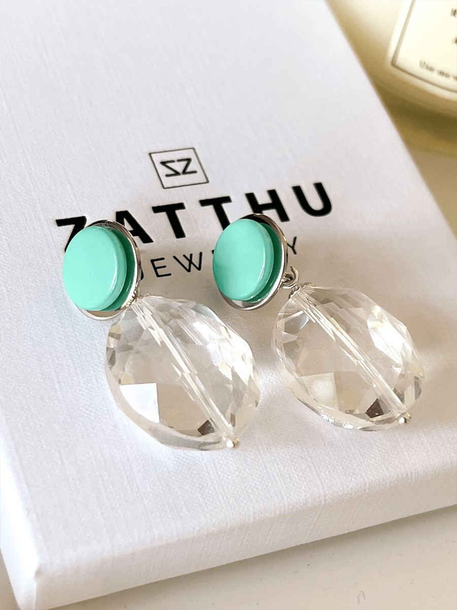 Isma oorbellen met kristal en turquoisegroene steen